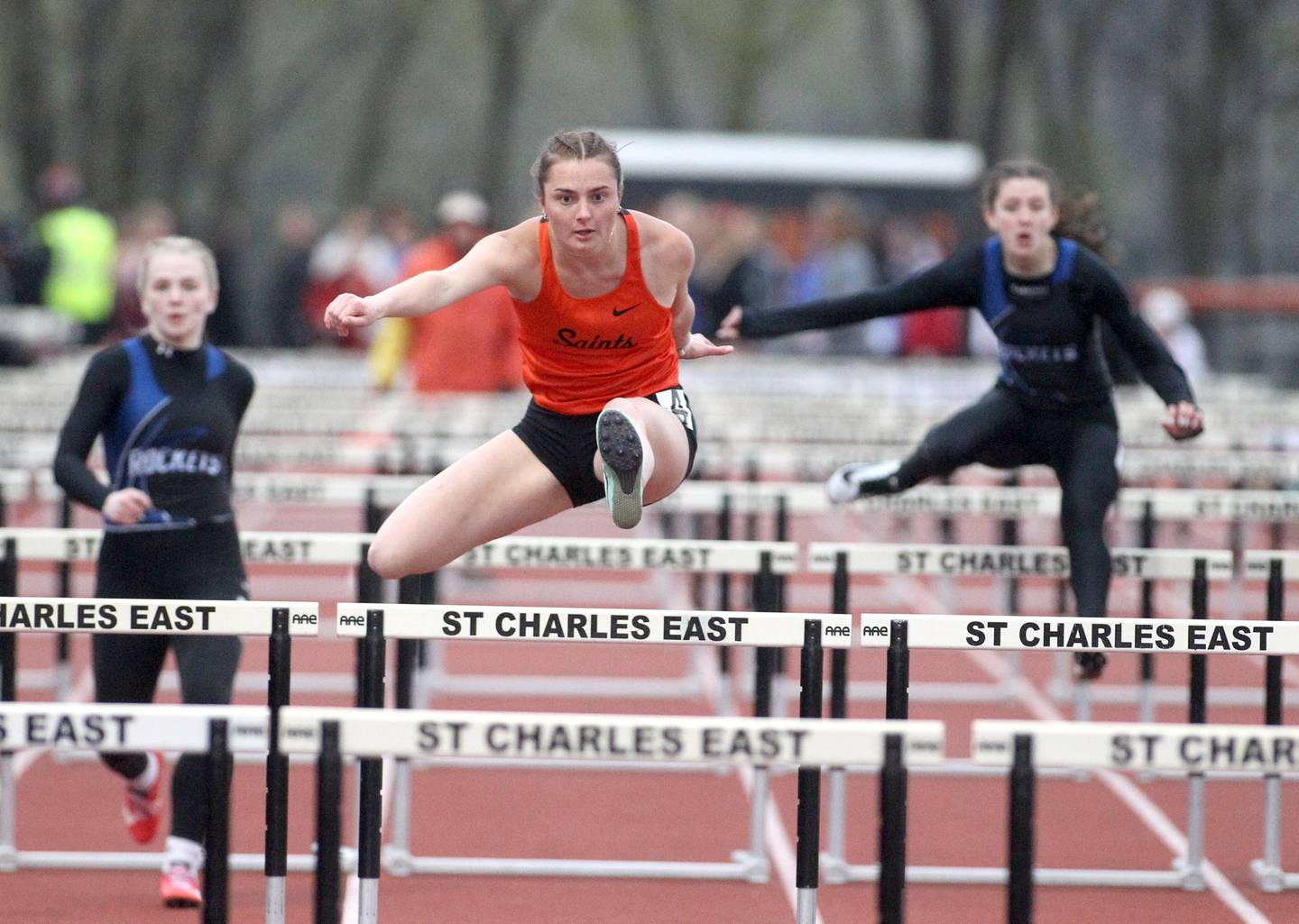 St. Charles East’s Katie Kempff competes in the 100-meter hurdles during the Kane County Girls Invite at St. Charles East on Thursday, April 28, 2022.