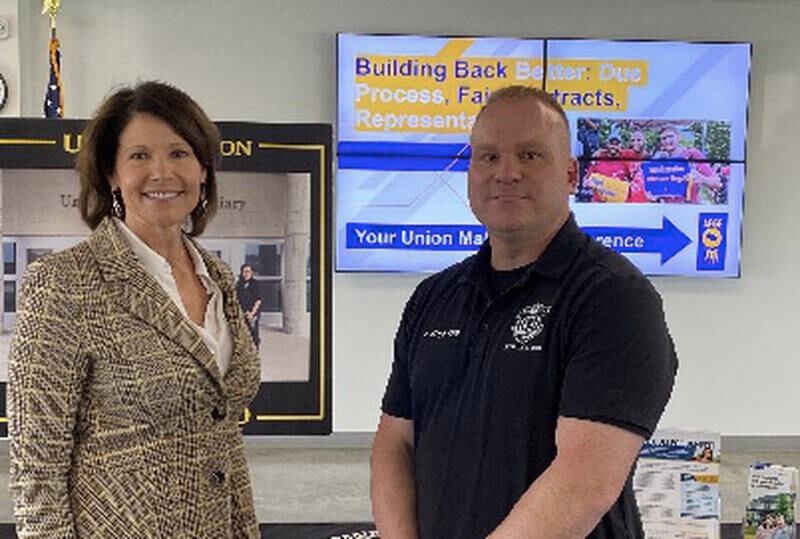 Jon Zumkehr president AFGE Local 4070, and U.S. Rep Bustos, D-17th District pose in an undated photo at Thomson Prison.