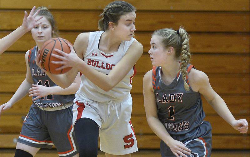 Streator’s Marissa Vickers pulls the ball away as Flanagan-Cornell/Woodland’s Ella Derossett who tries to knock the ball away in the 2nd period on Tuesday, Jan. 24, 2023 at Streator High School