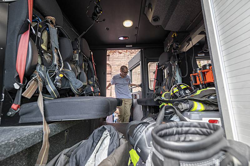 Merlin is helped into the back of the truck Sunday, Sept. 17, 2023. After getting a tour of the cab, the department gave him a special ride around the city in the big red machine.