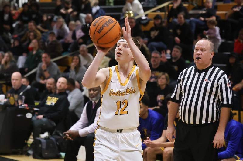 Joliet West’s Trooper Price takes the corner shot against Joliet Central on Tuesday, Feb. 17, 2026 in Joliet.