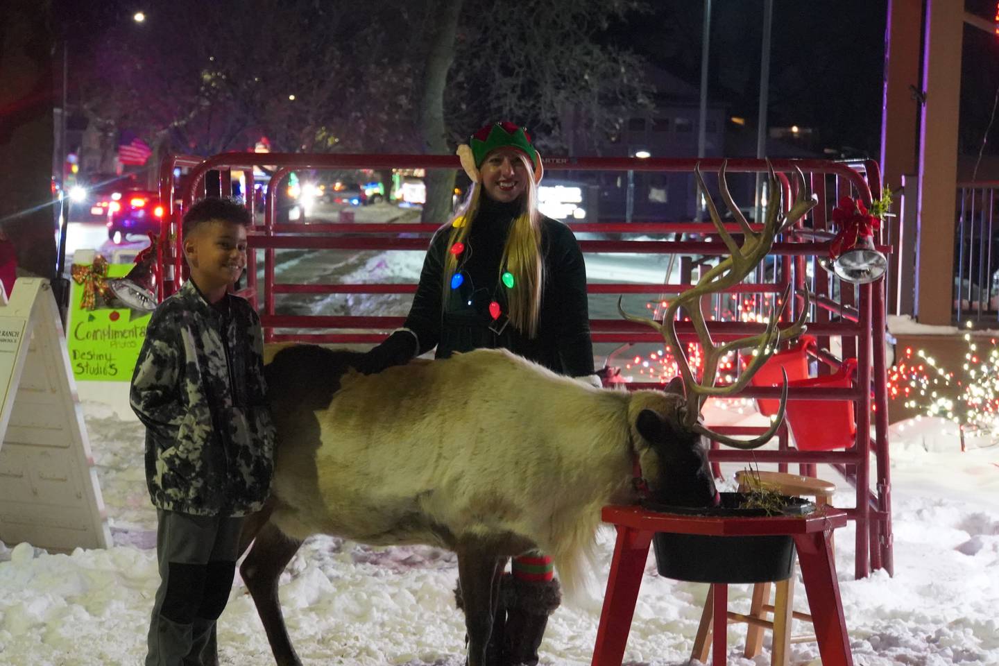 A child meets a reindeer that was on display at Rochelle's annual Old Fashioned Christmas Walk event on Friday, Dec. 5, 2025.