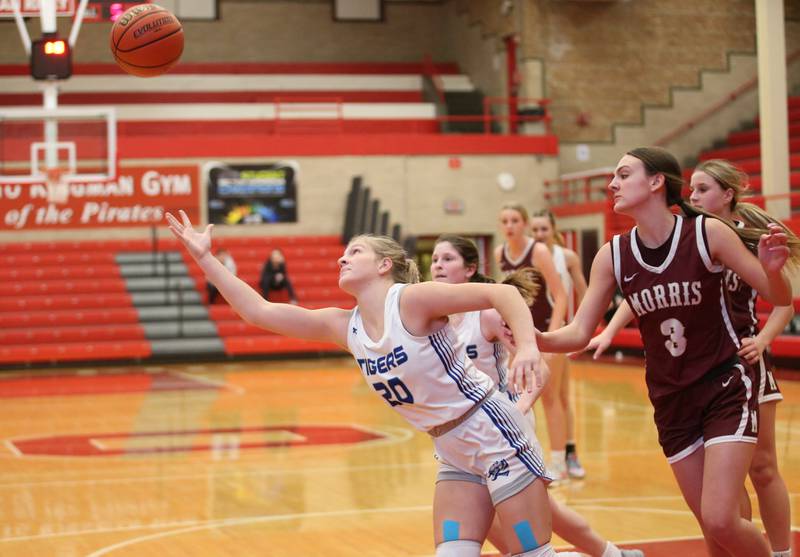 Princeton's Reese Reviglio lunges out of the lane to grab a rebound over Morris's Lily Hansen during the Lady Pirate Holiday Tournament on Wednesday, Dec. 20, 2023 in Kingman Gym.