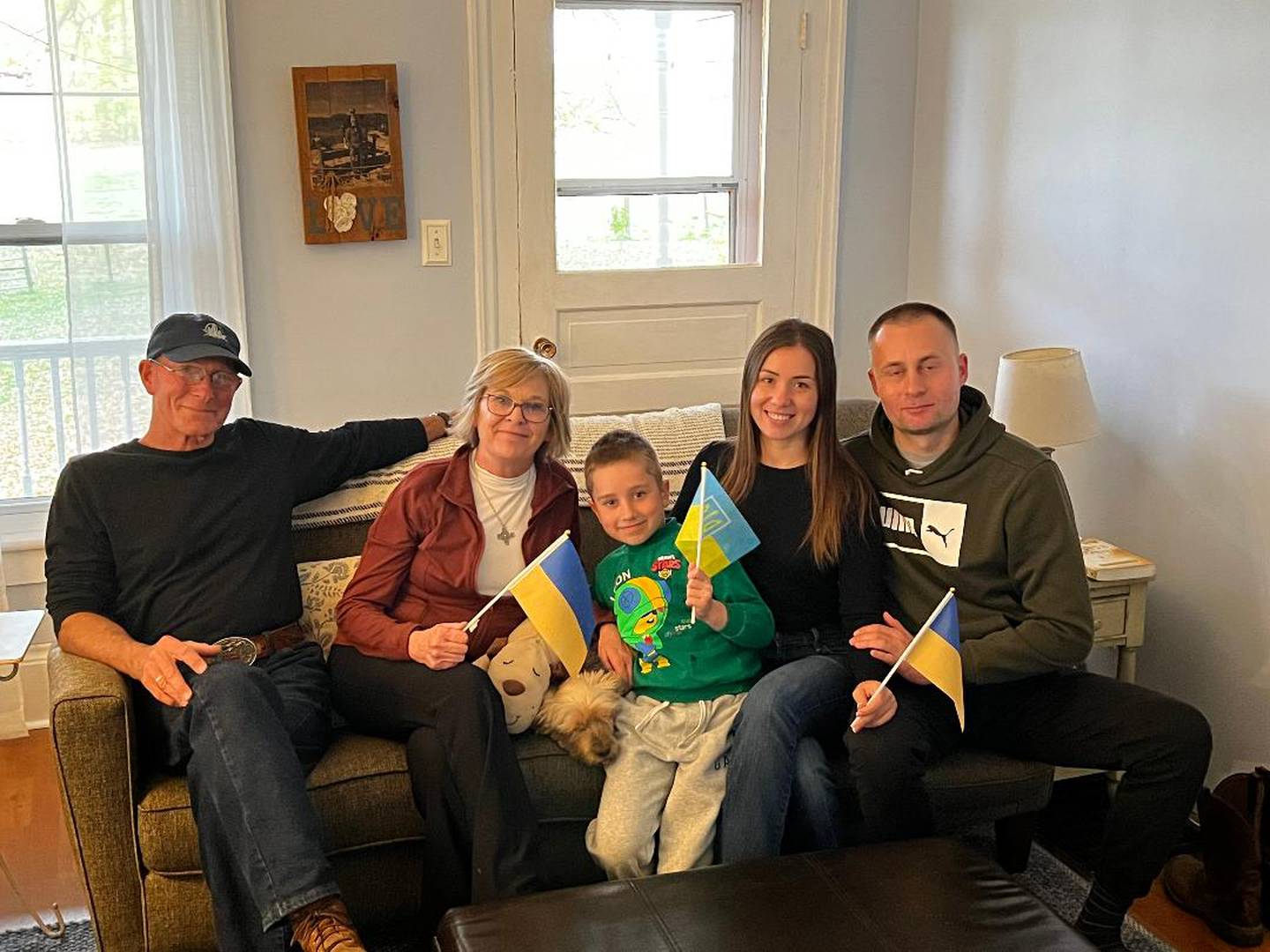 David and Dawn Summers sit with Vova Avramenko, Olesia Avramenko, and Vlad Vitomskov.