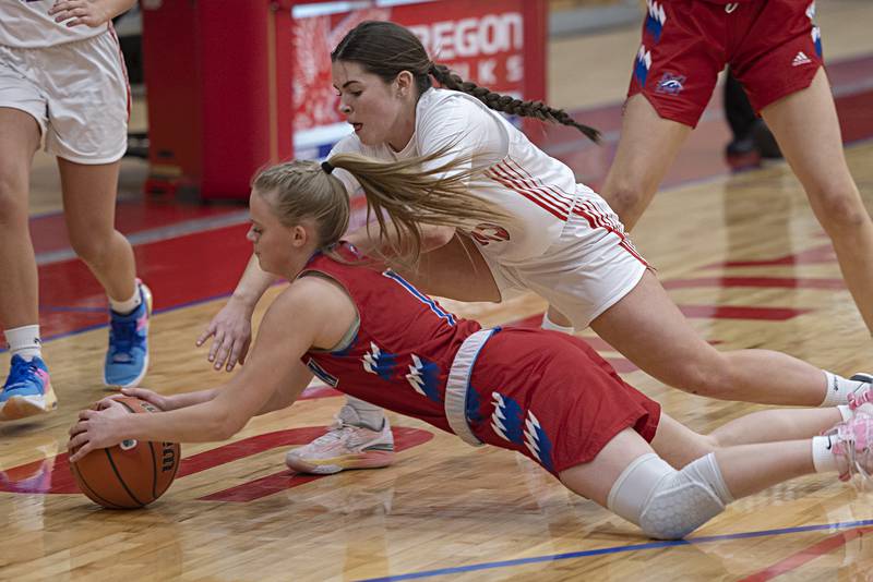 Oregon’s Mya Engelkes and Morrison’s Emery Brewer dive for a loose ball Wednesday, Jan. 17, 2024 at Oregon High School.