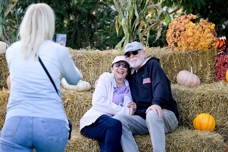 Kathy and Steve Ballard of Glenview poses for a photo while attending the annual Scarecrow Festival on Saturday, Oct 11, 2025 in St. Charles.