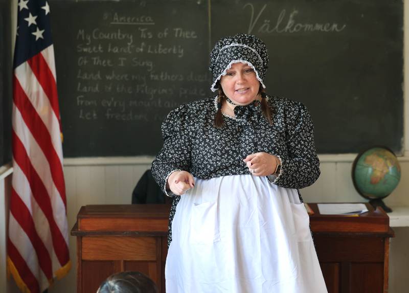 Southeast Elementary School third grade teacher Jami Sauber teaches her students Tuesday, Nov. 4, 2025, during a field trip to North Grove School, a one-room schoolhouse from 1878 in Sycamore.