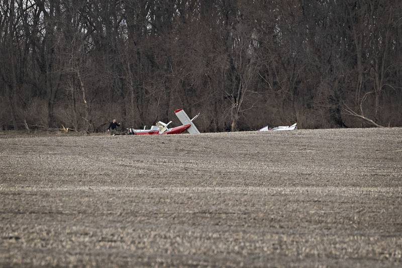 Investigators work at the scene of a plane crash in Rock Falls on Friday, March 20, 2026. One person was pronounced dead at the scene.