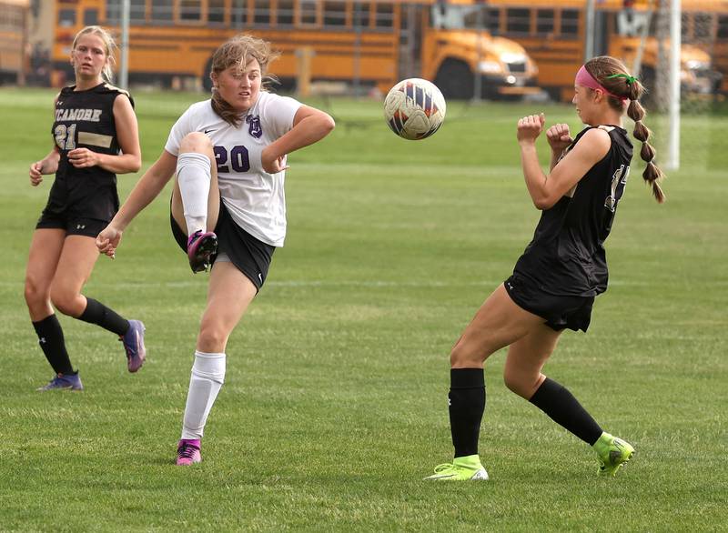 Dixon’s Carlie Cook kicks the ball by Sycamore's Addison Rodriguez during their game Thursday May 15, 2025, at Sycamore High School.