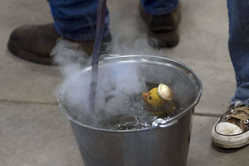 Mark Stach quenches the hot metal..