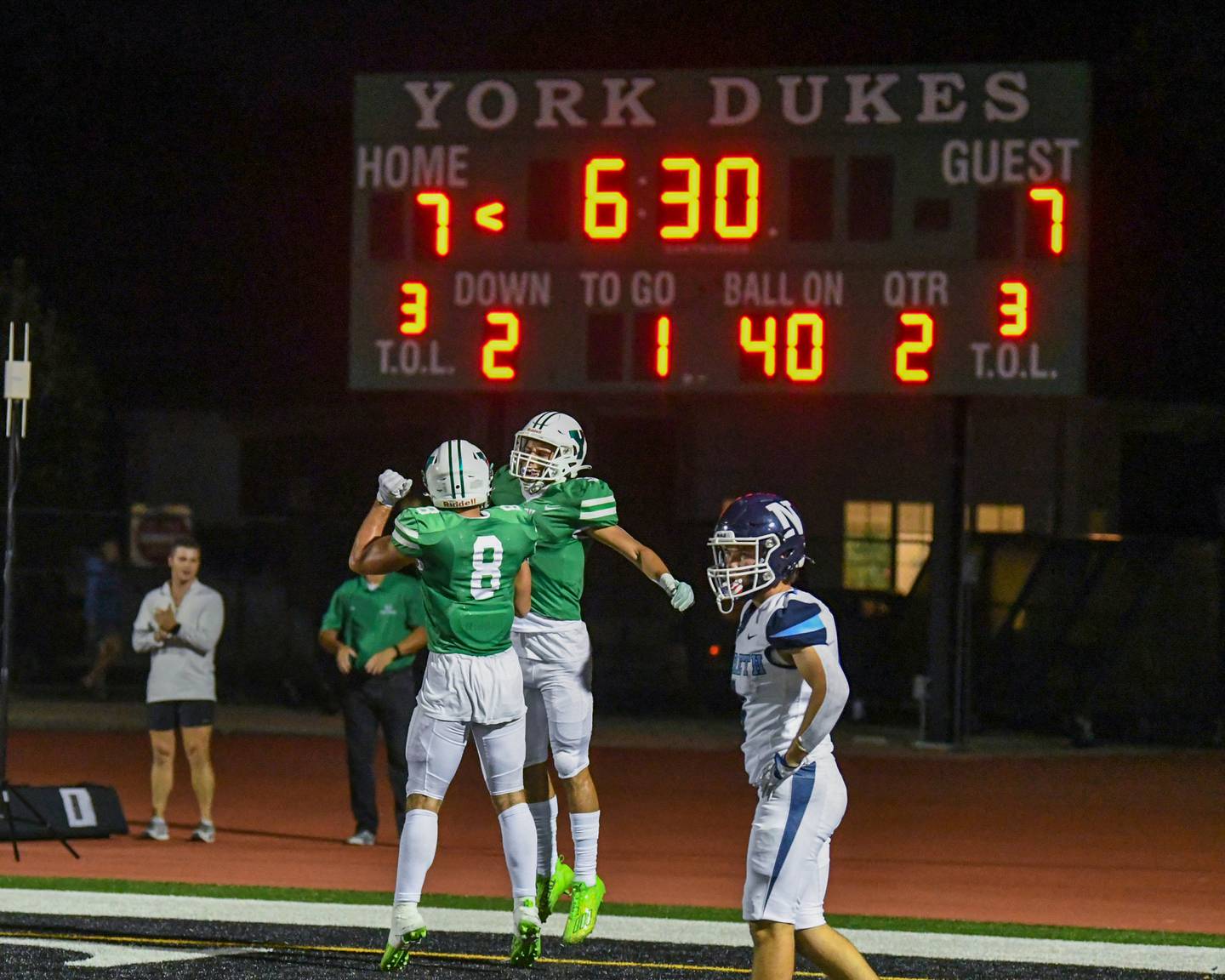 York’s wide receiver Chris Danko, right, celebrates with teammate Luka Triminch after Chris scores a touchdown in the second quarter on Friday Sep. 1, 2023, while taking on Nazareth Academy in Elmhurst.