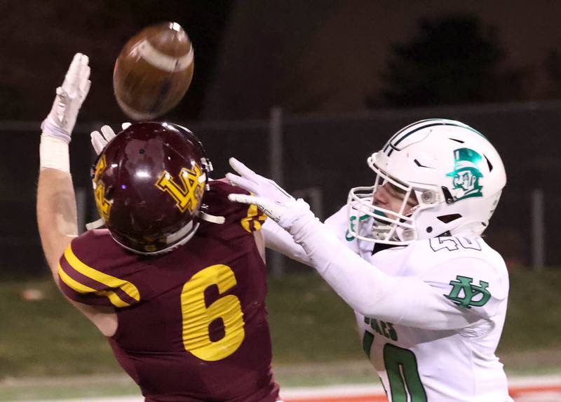 Loyola Academy's Gavin Vradenburg catches a long pass behind York’s Noah Zmrhal during their Class 8A state championship game Saturday, Nov. 30, 2024, in Hancock Stadium at Illinois State University in Normal.