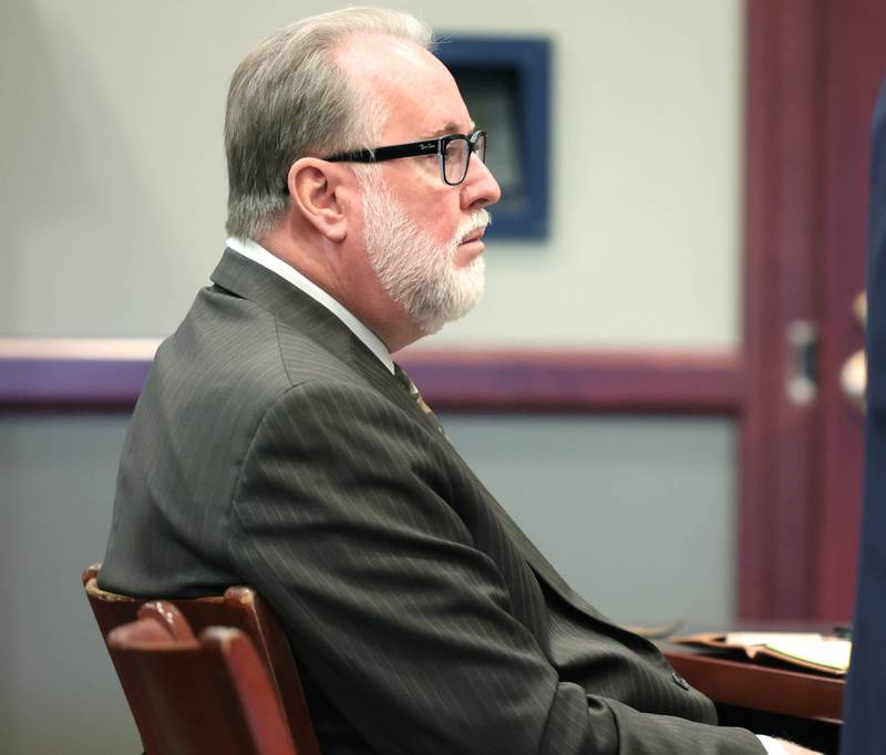 Former DeKalb School District 428 Superintendent Douglas Moeller listens as his attorney Clay Campbell makes his opening statement during the trial Wednesday, Oct. 5, 2022 at the DeKalb County Courthouse in Sycamore. Moeller was charged in April 2018 with non-consensual dissemination of private sexual images, a class 4 felony.