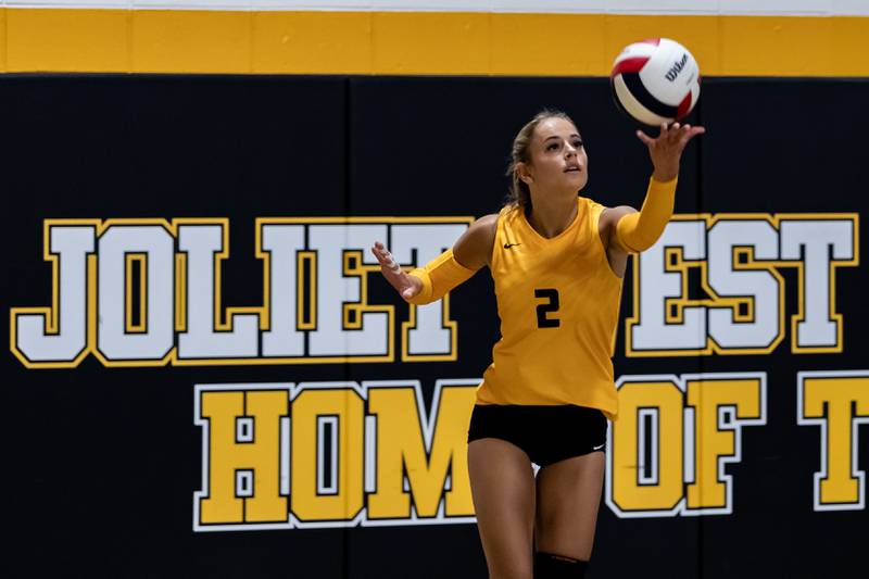 Joliet West's Lexie Grevengoed serves against Lincoln-Way East during a Varsity Volleyball match at Joliet West on Aug. 26, 2025.