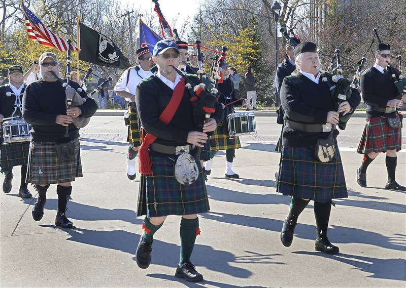 The Medinah Highlanders march along the parade route Sunday, Nov. 6, 2022, performing patriotic songs during the Utica Veterans Day Parade and Air Show.