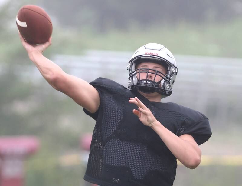 Kaneland quarterback Troyer Carlson throws a pass during practice Wednesday, Aug. 9, 2023, at the school in Maple Park.