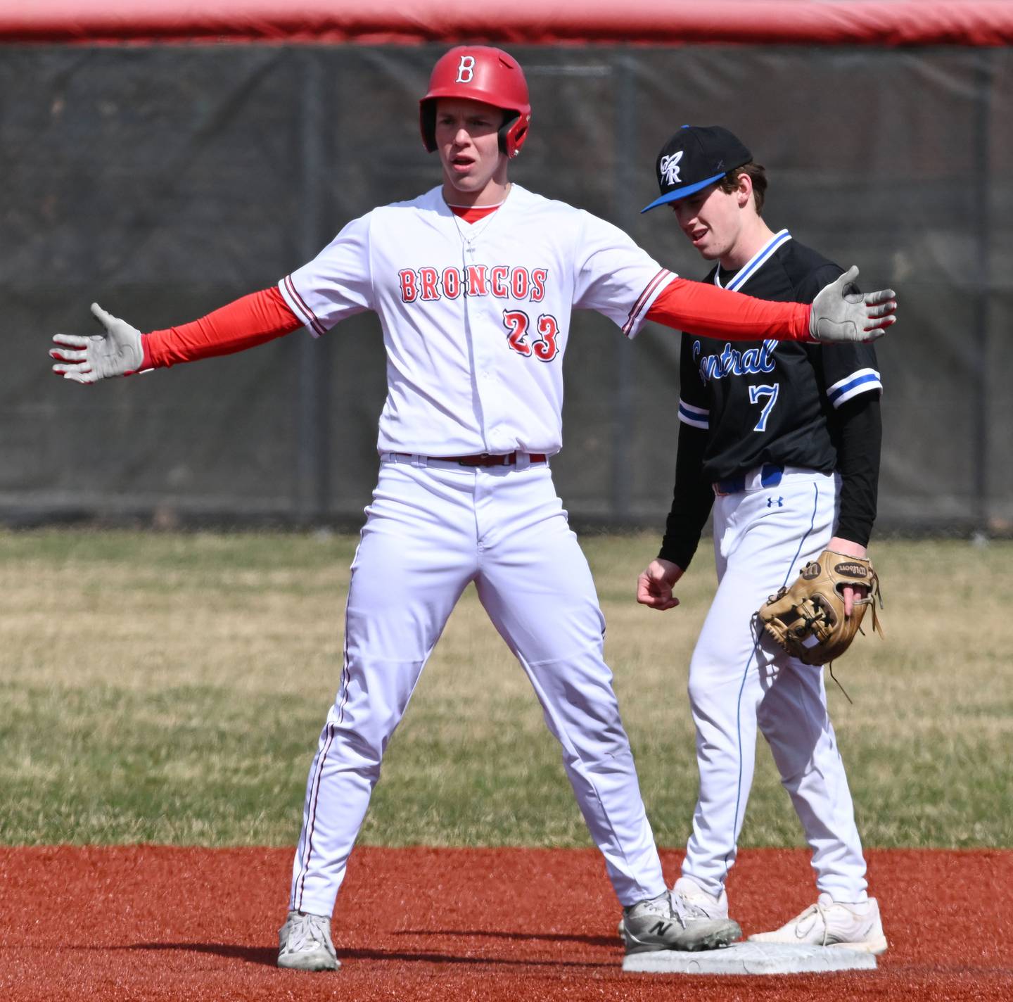Barrington’s Will Steffens celebrates a double as Burlington Central shortstop Wagner Viebrock walks back to his position Friday.