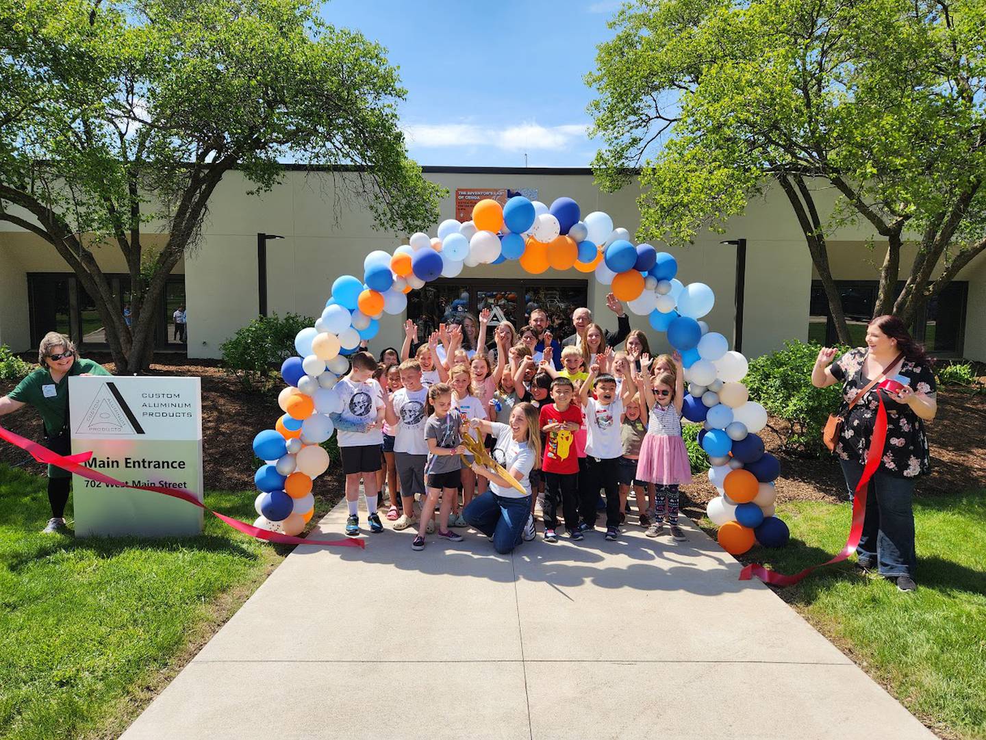 The Genoa Area Chamber of Commerce celebrating The Inventor Lab's new facility opening with a ribbon-cutting