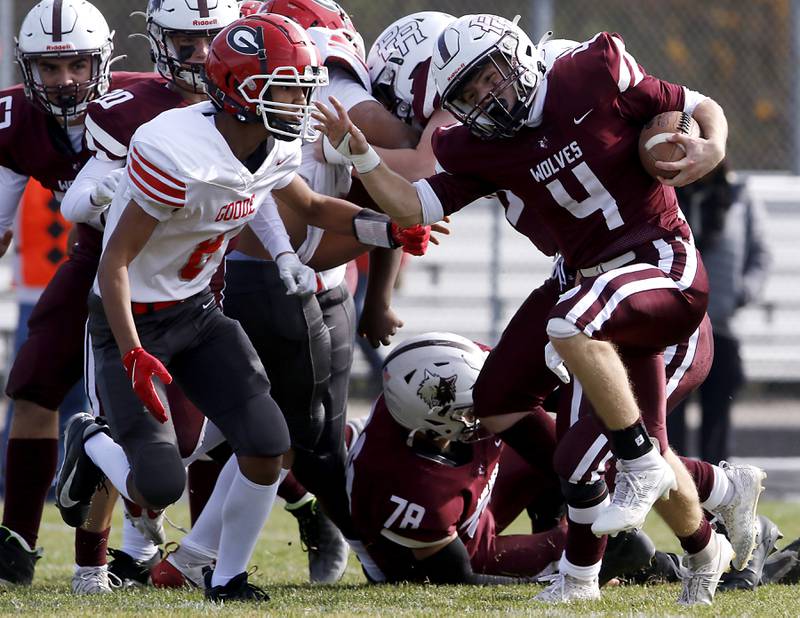 Prairie Ridge's Jack Finn runs with the ball as Chicago Goode's Zacharias Pagan tries to tackle Finn during an IHSA Class 5A first-round football game on Saturday, Nov. 2, 2024, at Prairie Ridge High School in Crystal Lake.