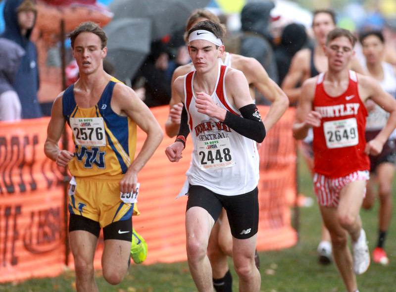 Wheaton North's Aidan Murphy (left) and Lincoln-Way Central's Braden Hoff (right) compete in the Class 3A State Cross Country Championships on Saturday, Nov. 9, 2024 at Detweiller Park in Peoria.