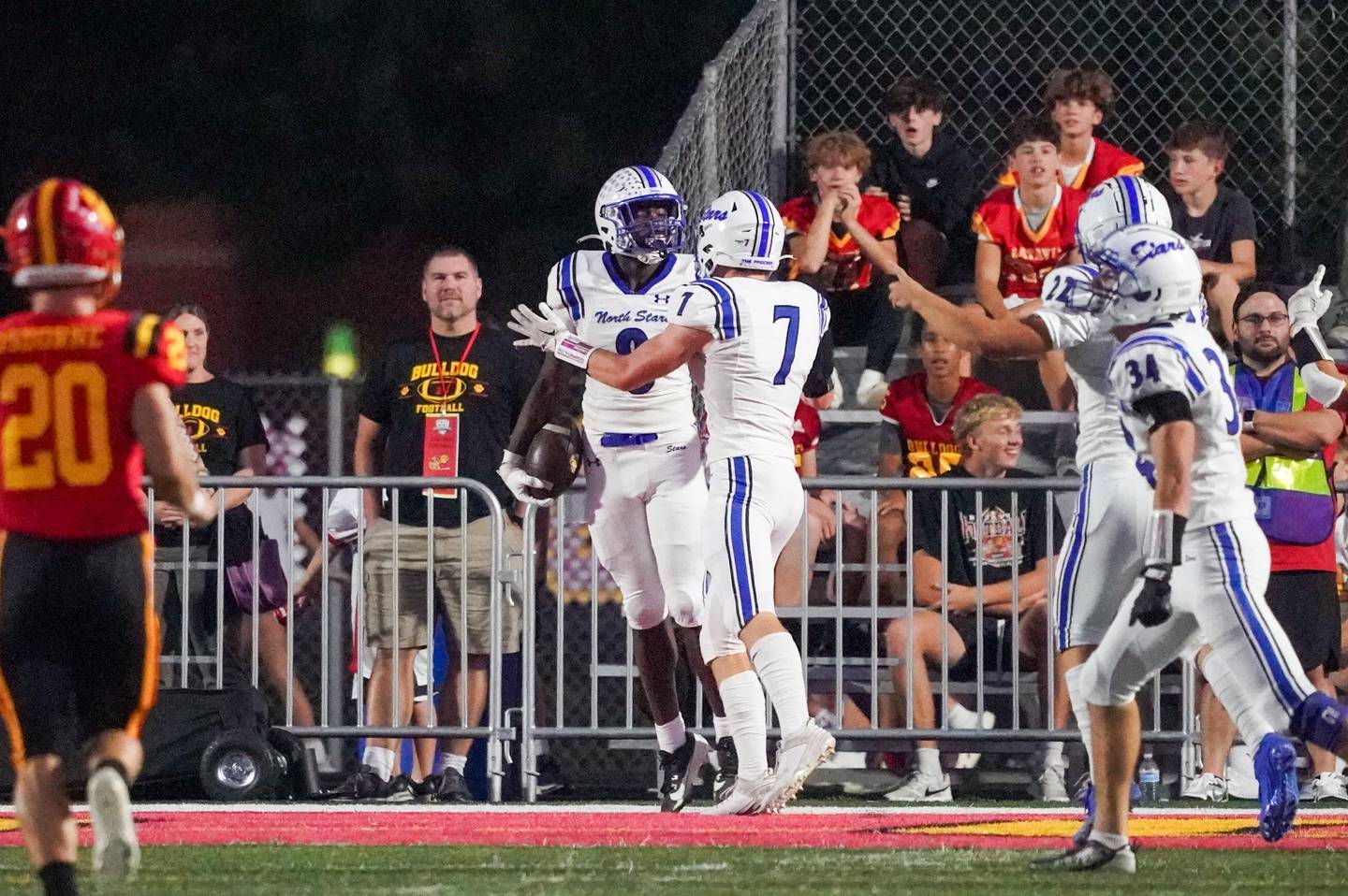 St. Charles North's Joell Holloman (8) celebrates with his team after scoring on a fumble recovery against Batavia during a football game at Batavia High School on Friday, Sep 20, 2024.