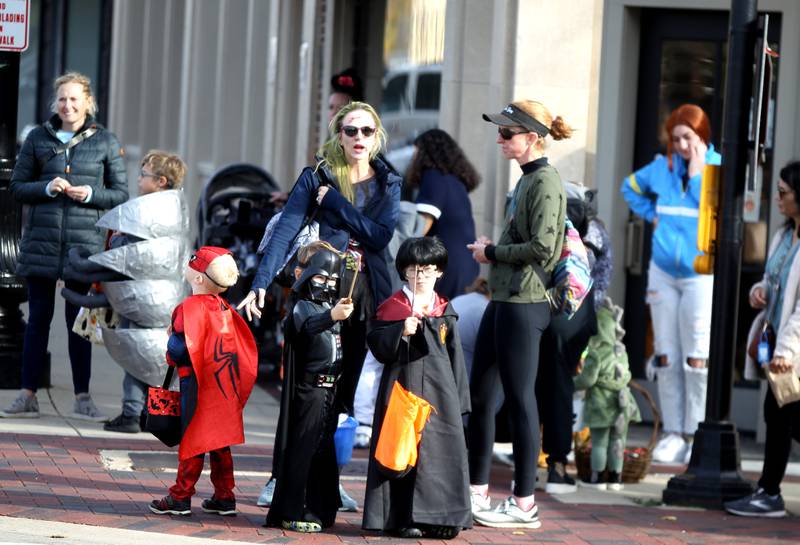 Children go trick-or-treating at Geneva businesses on Thursday, Oct. 27, 2022.