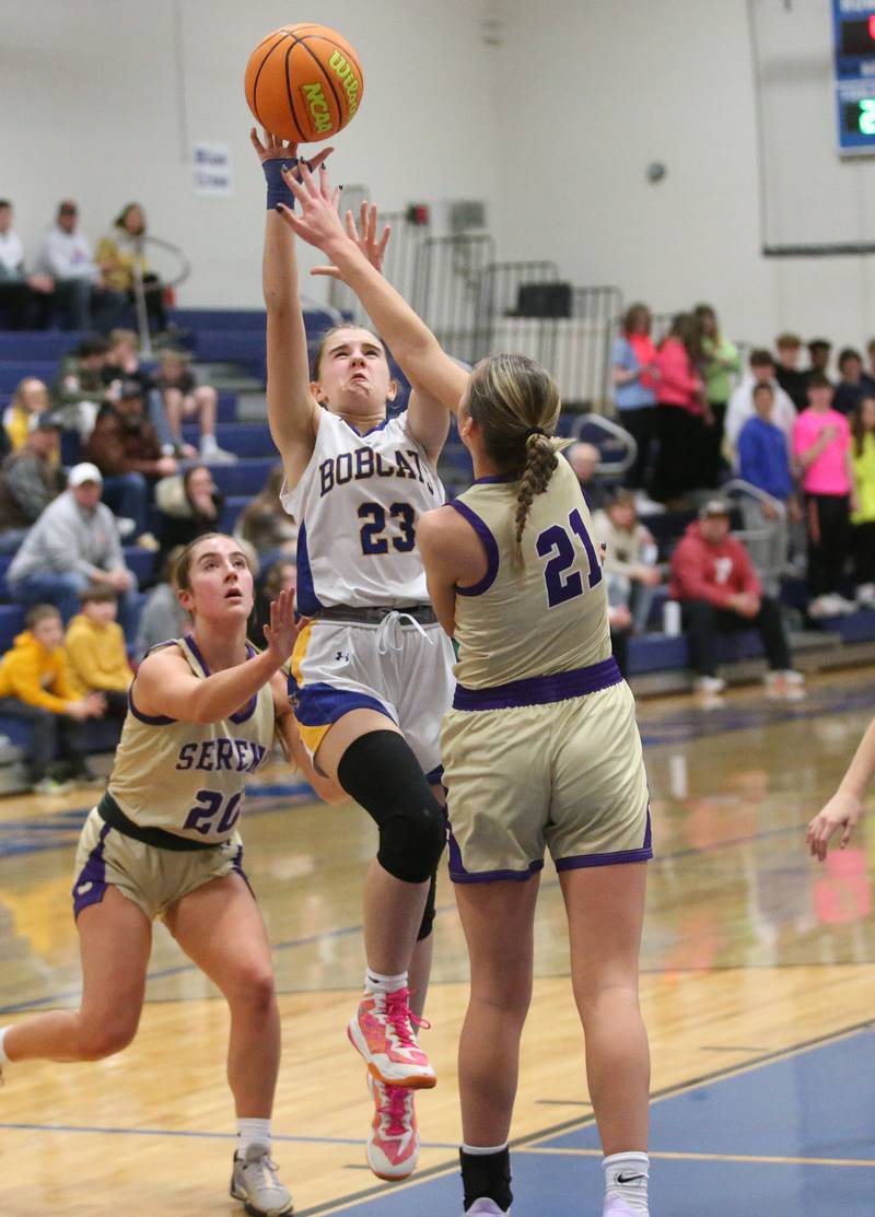 Somonauk/Leland's Ashley McCoy lets go of a shot between Serena defenders RayElle Brennan. and teammate Kendall Whiteaker on Monday, Feb. 10, 2025 at Somonauk High School.