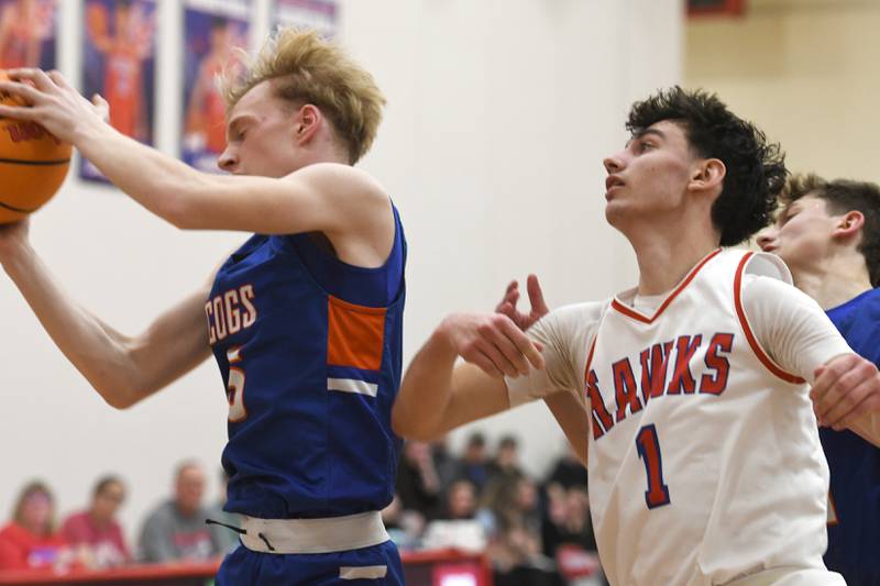 Genoa-Kingston's Blake Ides (5) rebounds against Oregon's Benny Olalde (1) on Friday, Jan. 30, 2026 at the Blackhawk Center in Oregon.