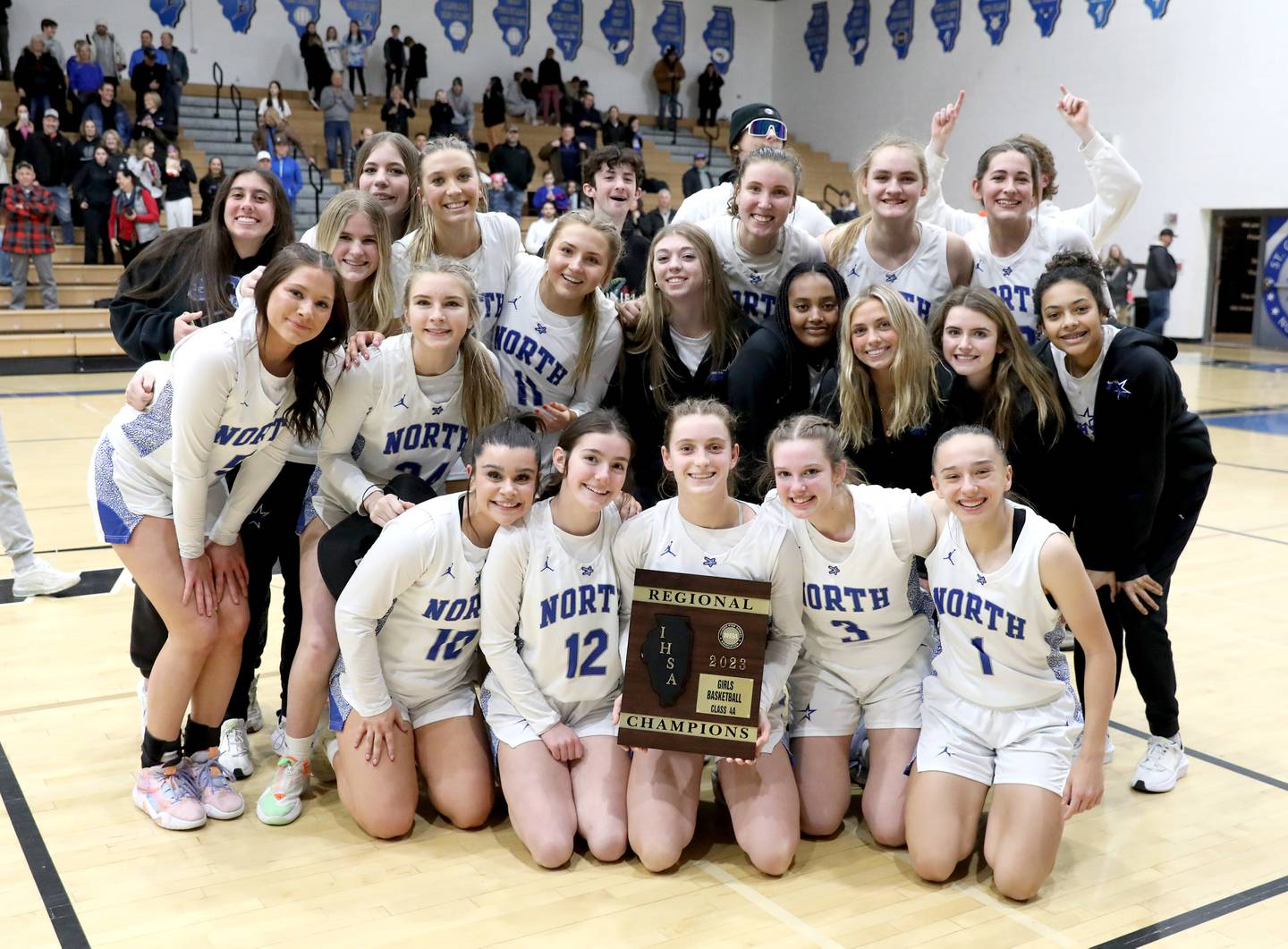 St. Charles North players celebrate their Class 4A St. Charles North Regional final win over Wheaton North on Thursday, Feb. 16, 2023.