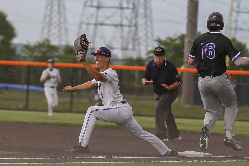 Oswego East's Zach Polubinski (8) catches a throw at first during Class 4A Romeoville Sectional semifinal between Oswego East at Downers Grove North.  May 31, 2023.