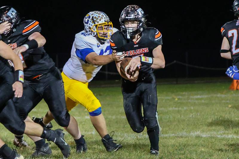 Leelynd Durbin of Flanagan Cornell Woodland runs with ball whilst being held by Cole Baulch of Galva on Friday, October 25, 2024 at Flanagan High School in Flanagan.