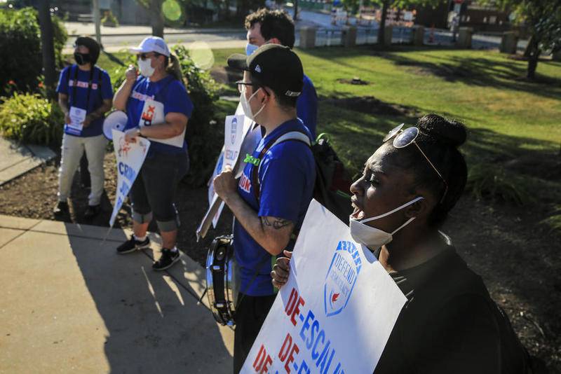 Members of the Will County Progressives protest police brutality and demand criminal justice reform Tuesday outside Joliet City Hall in Joliet.