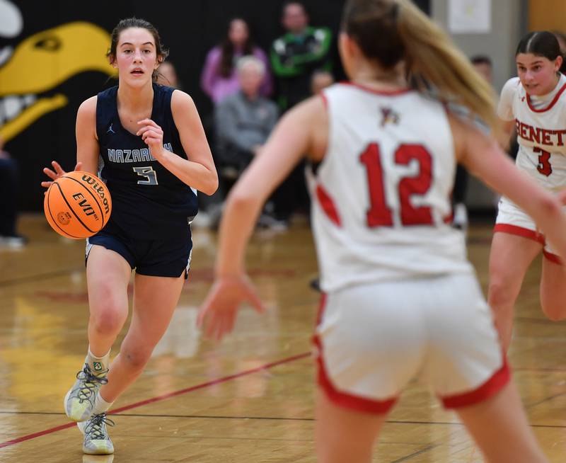 Nazareth’s Sophia Towne (left) drives towards Benet’s Lindsay Harzich (12) during a game on January 29, 2025 at Benet Academy in Lisle.