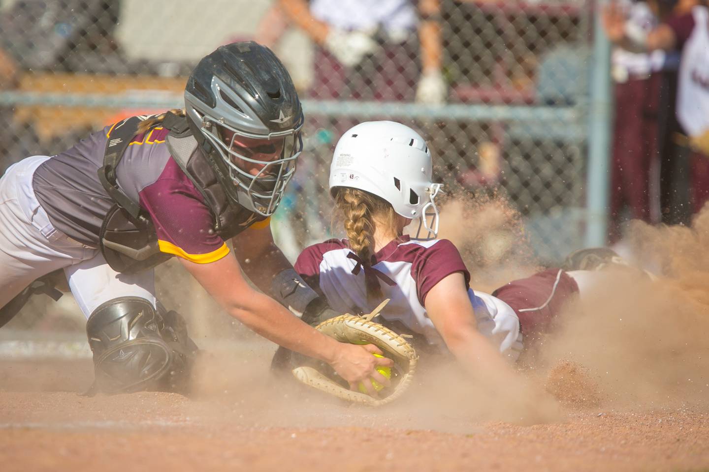 Marengo catcher Taylor Davison (16) finishes a tag of Marengo's Lilly Kunzer (10) at home plate in the third inning of the game at Richmond-Burton High School, Richmond, Ill., Friday, June 4, 2021. The Rockets won, 11-9, and will play the winner of the Oregon Regional Tuesday, June 8.