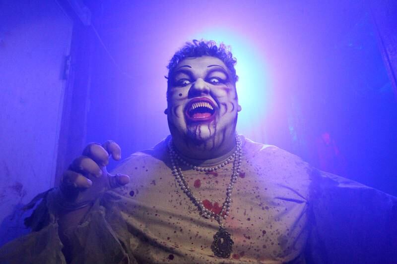 Miguel Ramos, of Johnsburg (Velma Von Cackle) scares visitors as they go through the Realm of Terror Haunted House in Round Lake Beach. Ramos did all his own makeup and made his costume.