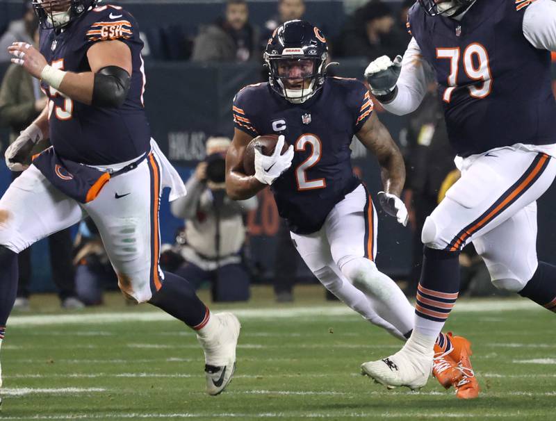 Chicago Bears wide receiver DJ Moore follows his blockers during their game against the Seattle Seahawks Sunday, Dec. 26, 2024, at Soldier Field in Chicago.