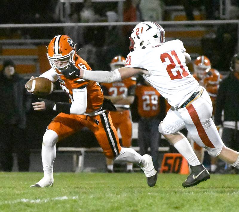 Byron's Andrew Talbert (16) moves to avoid Oregon's Zandyr Withers (21) during 3A football playoff action on Friday, Oct. 31, 2025 at the Everett Stine Stadium un Byron.