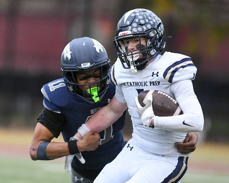 Chicago Hope Academy’s Devin Mims (11) tries to tackle IC Catholic Prep's Will Schmidt (1) during the 3A Playoff game on Saturday Nov. 1, 2025, held at Altgeld Park in Chicago.