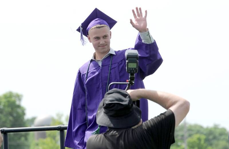 Noah Uhrich acknowledges the crowd during Plano High School's graduation ceremony on the football field, Sunday, May 19, 2024.