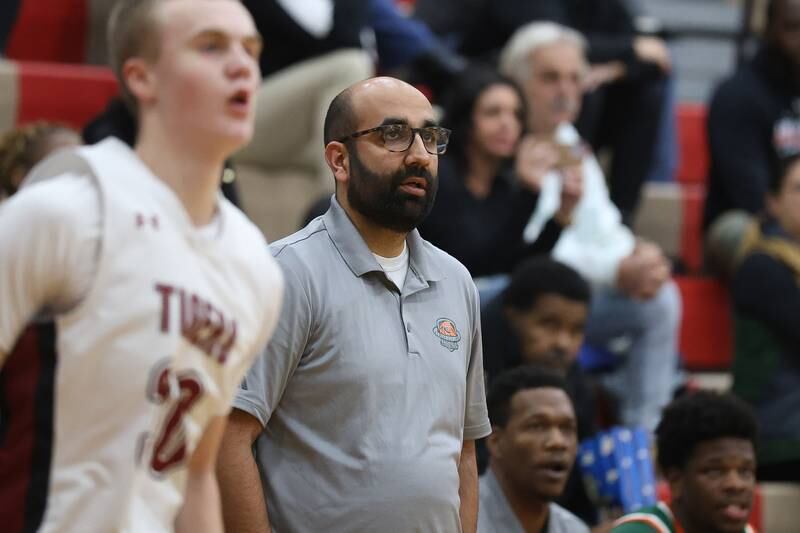 Plainfield East head coach Kanwer Sarkaria watches a play develop against Plainfield North on Tuesday, Dec. 9, 2025 in Plainfield.