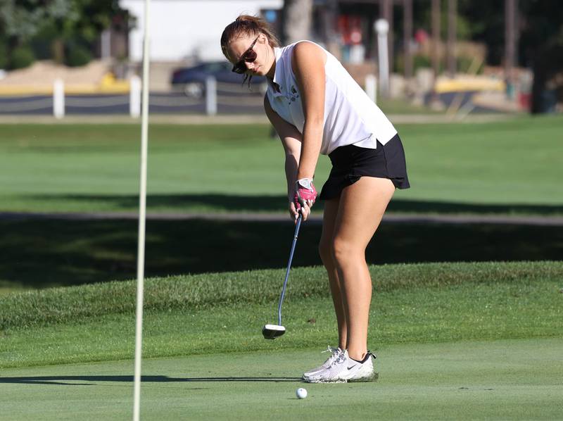 DeKalb-Sycamore co-op’s Taya Johnson putts on the second green Tuesday, Sept. 23, 2025, during the Interstate 8 girls golf meet at the Sycamore Golf Club.