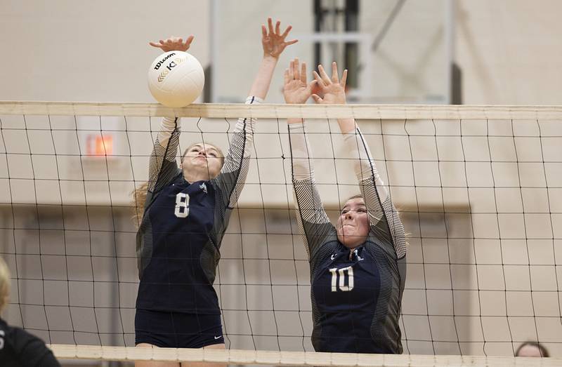 River Ridge’s Gwen Miller (left) and Sophie Buck go up to block a shot Wednesday, Nov. 2, 2022 in the sectional championship game against Newman.
