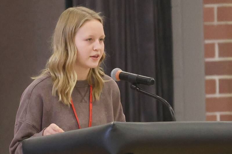 Parkside Middle School student Sophia DelPivo reads her poem "Liberty and War" during the Veterans Day program on Tuesday, Nov. 11, 2025 in Peru.