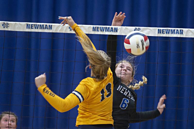 Newman's Jess Johns works the net against Sterling's Katie Dittmar Thursday, Aug. 25, 2022.