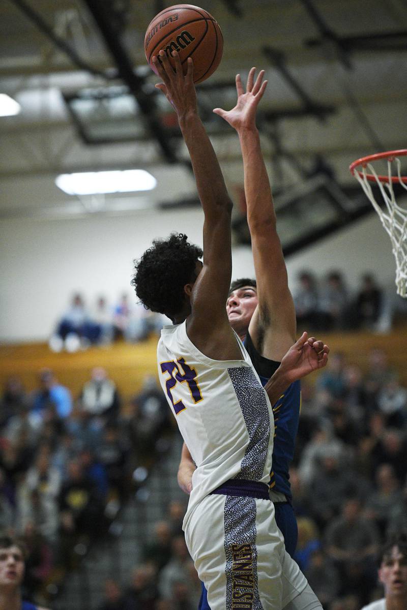John Starks/jstarks@dailyherald.com
Rolling Meadow’s Cameron Christie shoots over Lyon’s Carter Reid in the Jack Tosh boys basketball tournament at York High School in Elmhurst on Friday, December 30, 2022.