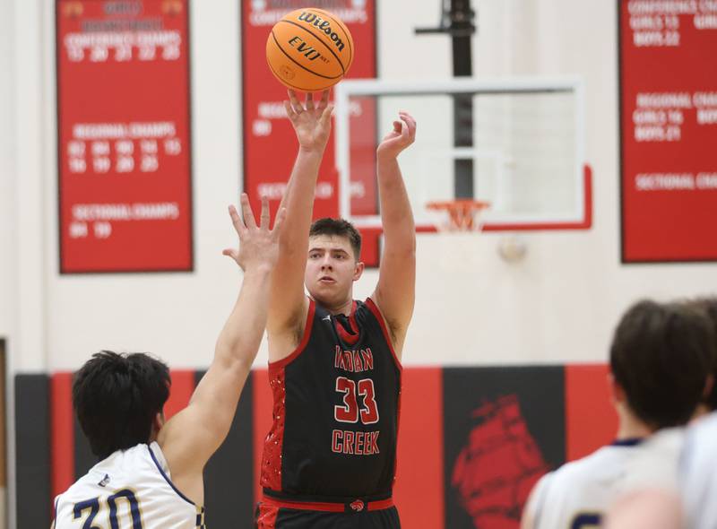 Indian Creek's Payton Hueber lets go of a shot against Marquette during the Class 1A Sectional game on Friday, March 6, 2026 at Amboy High School.