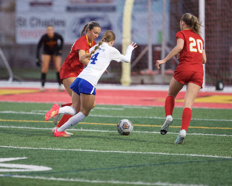 St. Charles North's Kaitlyn Ndera  looks towards the goal against Batavia's defense on Thursday, April 17,2025 in Batavia.
