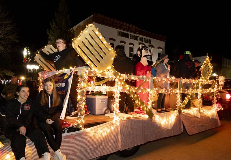 Hall High School's Red Devils Grill Team, which won the state championship for best pork chop, accepted the trophy Saturday, Nov. 26, 2022, and came straight the Spring Valley Lighted Christmas Parade with their display.