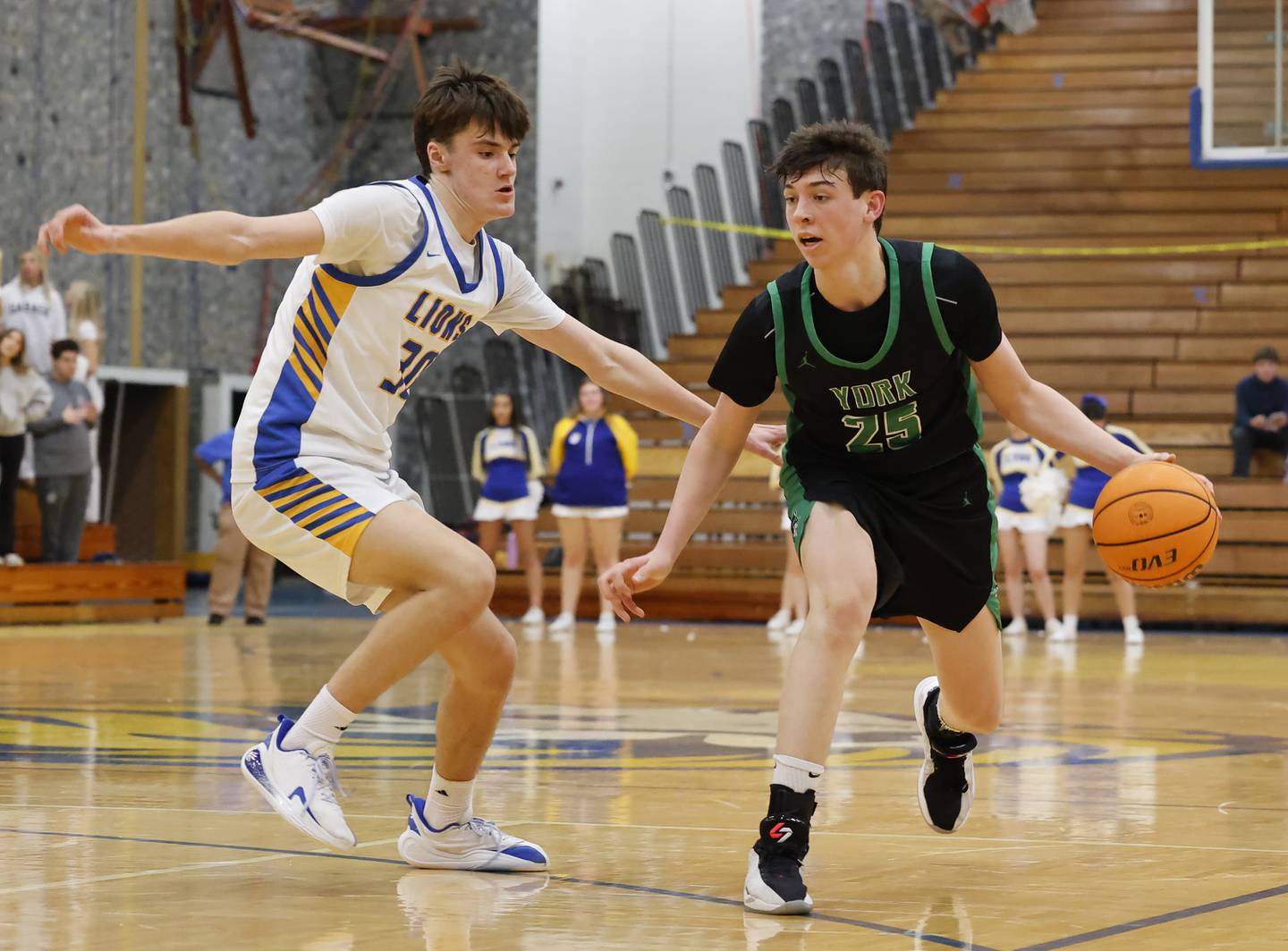York's Joseph Lubbe (25) tries to get past Lyons' Nate Woods during a varsity basketball game between York Community and Lyons Township high schools on Friday, Jan. 9, 2026 in La Grange.