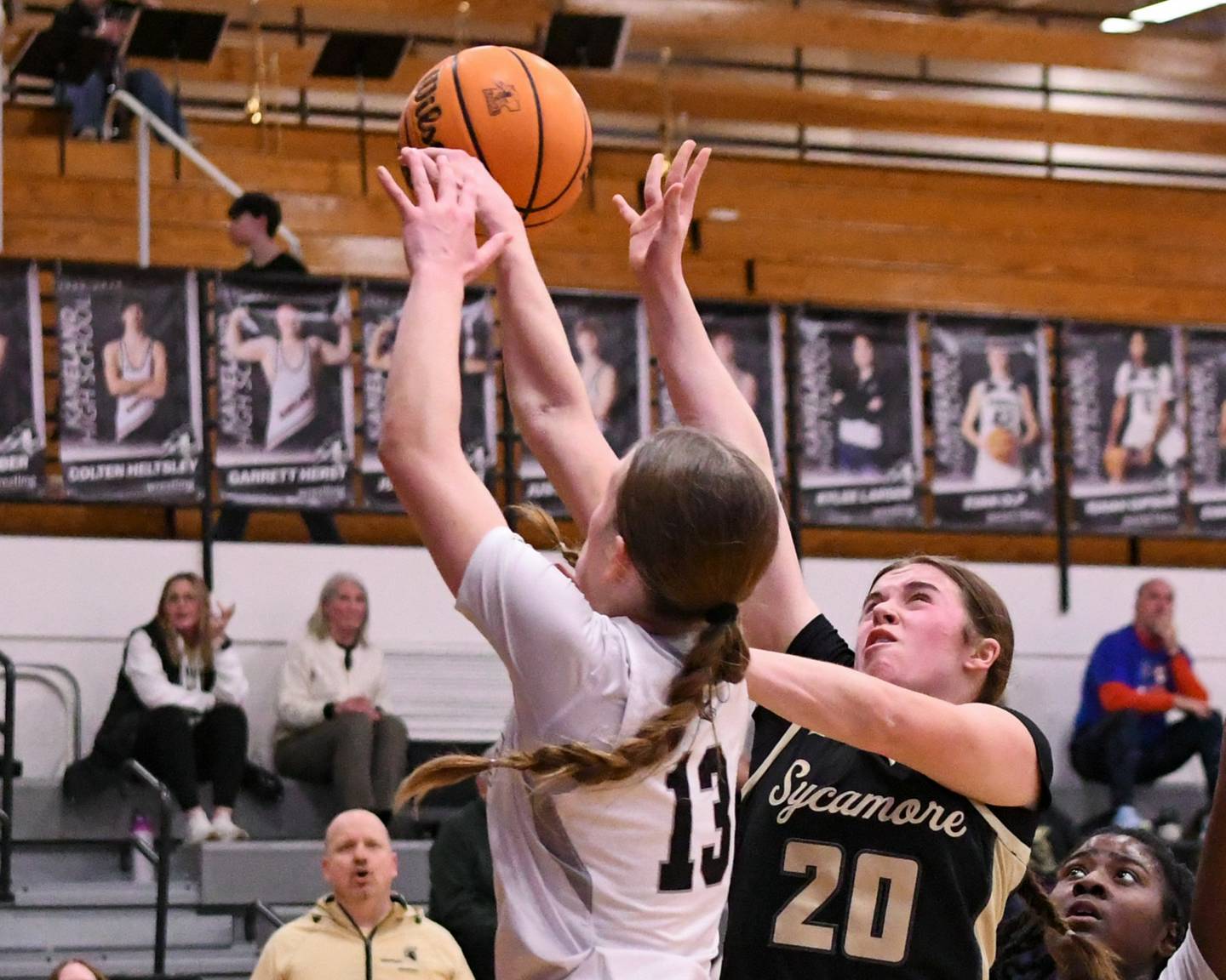 Kaneland's Grace Brunscheen (13) blocks the shot of Sycamore's Callie Countryman (20) during the game on Wednesday Feb. 4, 2026, held at Kaneland High School.